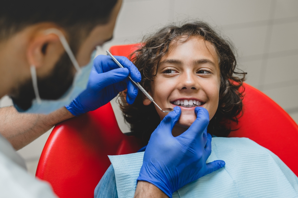 Banner da matéria Como cuidar dos dentes das crianças: guia de saúde bucal infantil para pais e responsáveis
